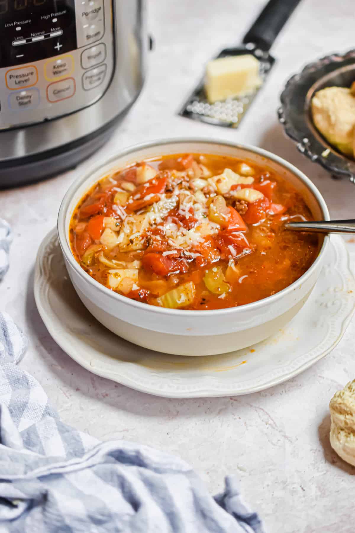 The soup is in front of the Instant Pot.