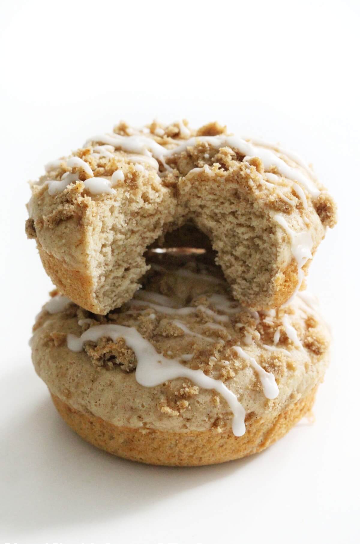 two gluten-free coffee cake doughnuts stacked