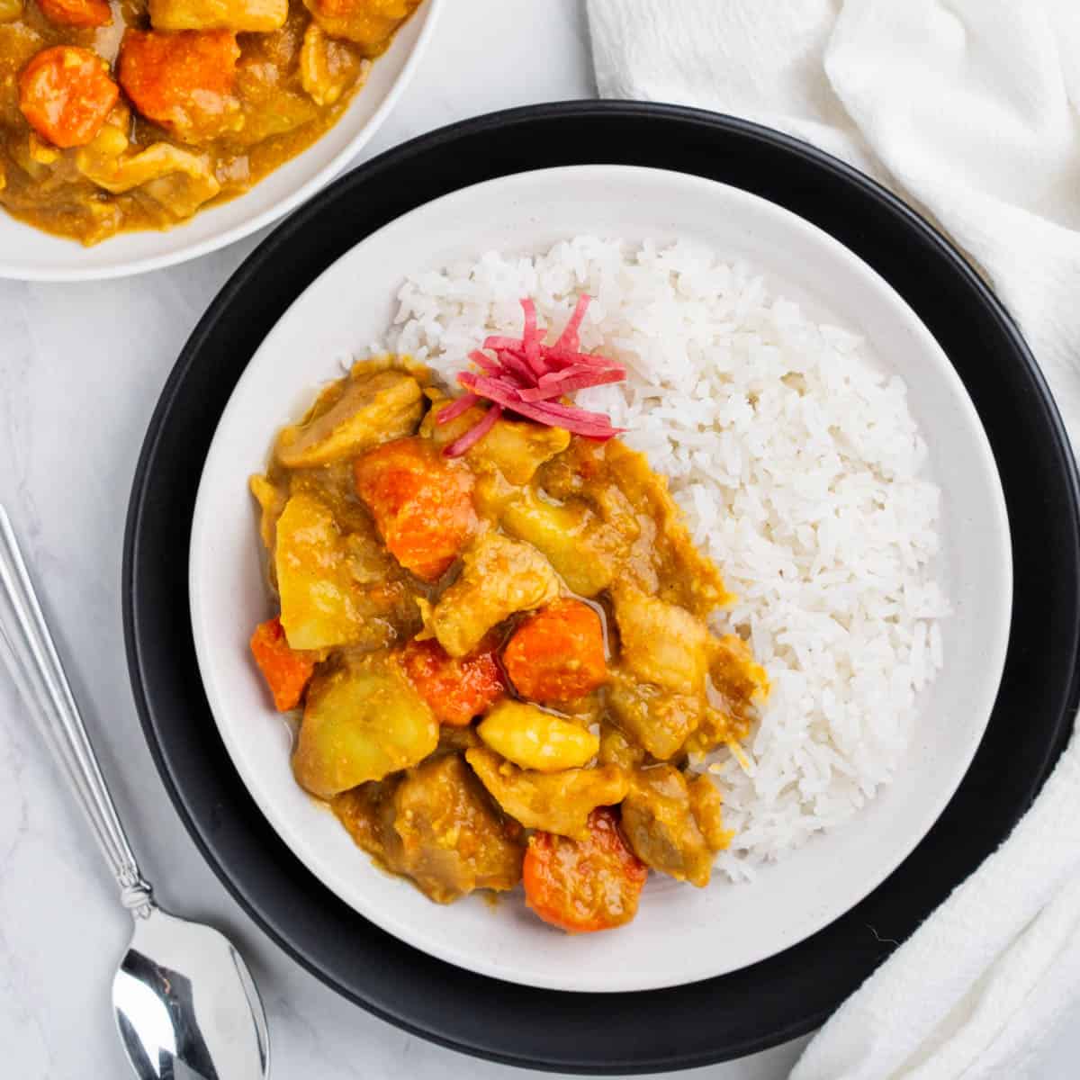Plate of Japanese Chicken Curry with side of white rice.