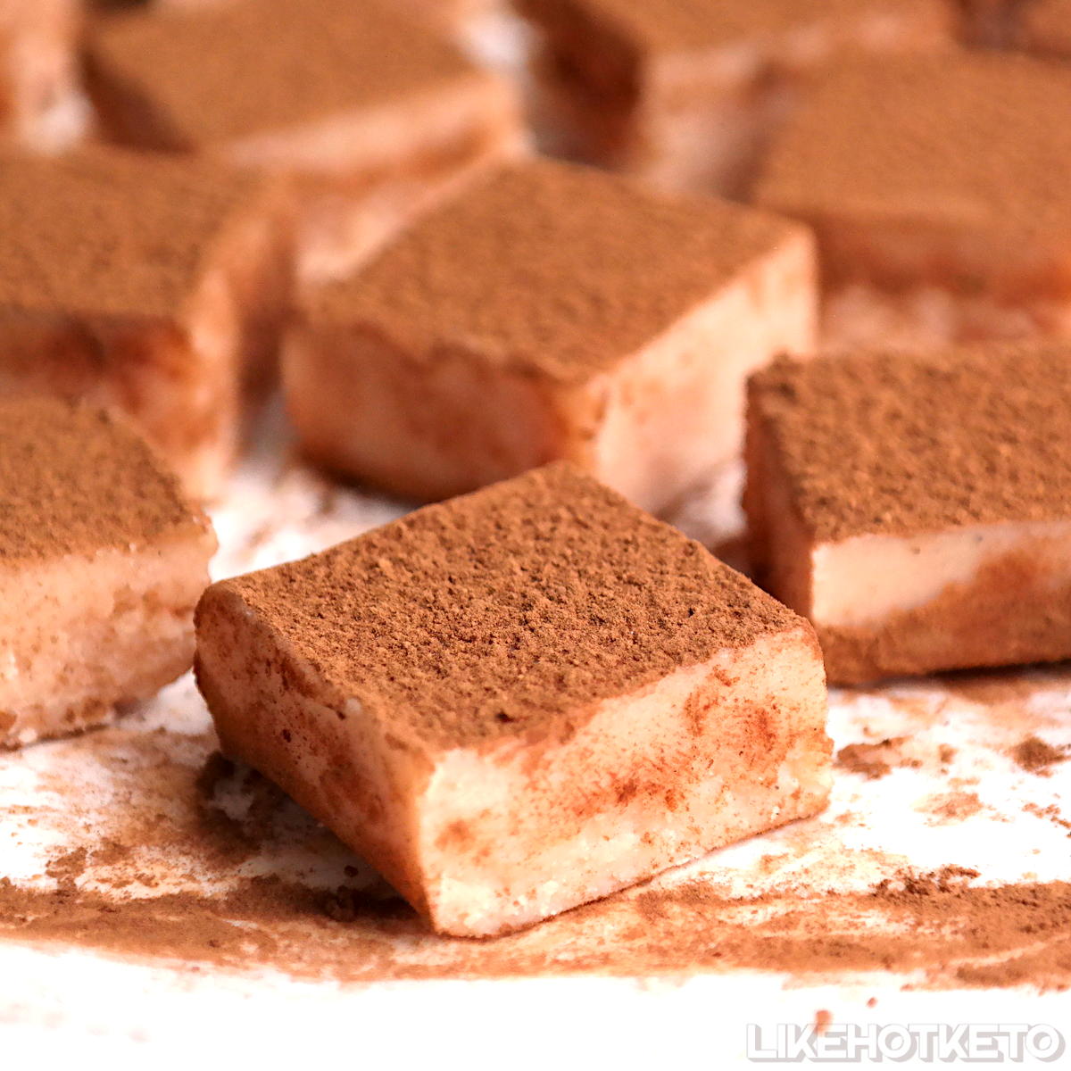 Low-carb Champagge pink chocolate truffels dusted with cocoa powder.