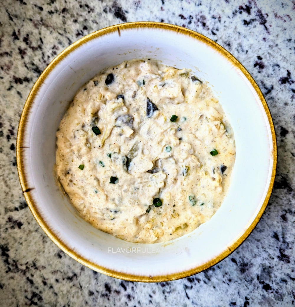 A white bowl filled with Slow Cooker Potato & Poblano Chowder