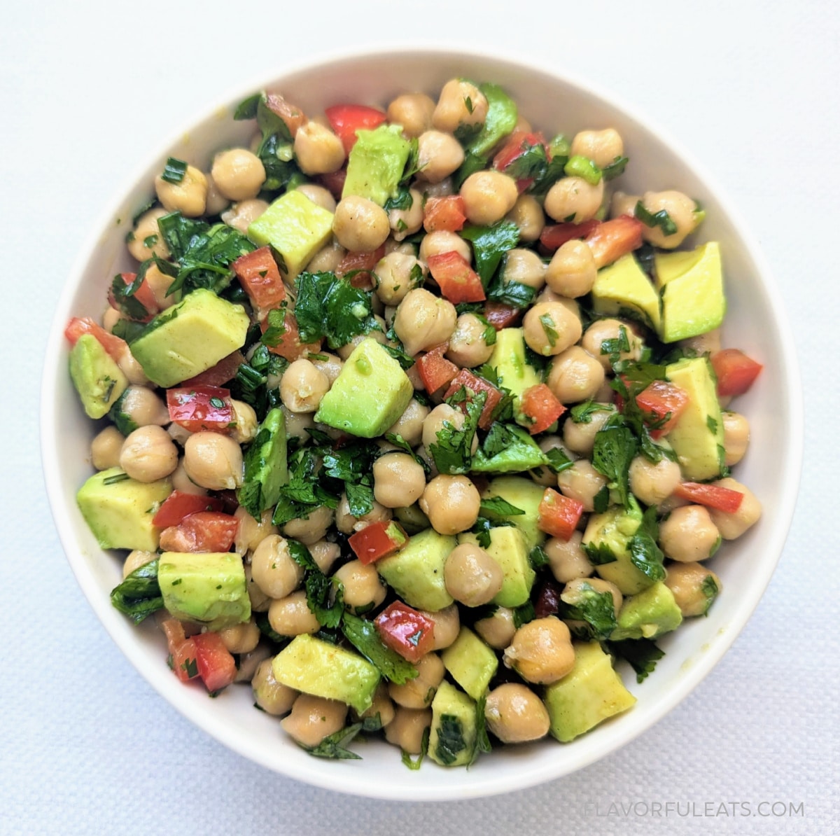 Chickpea Avocado Salad in a white bowl.
