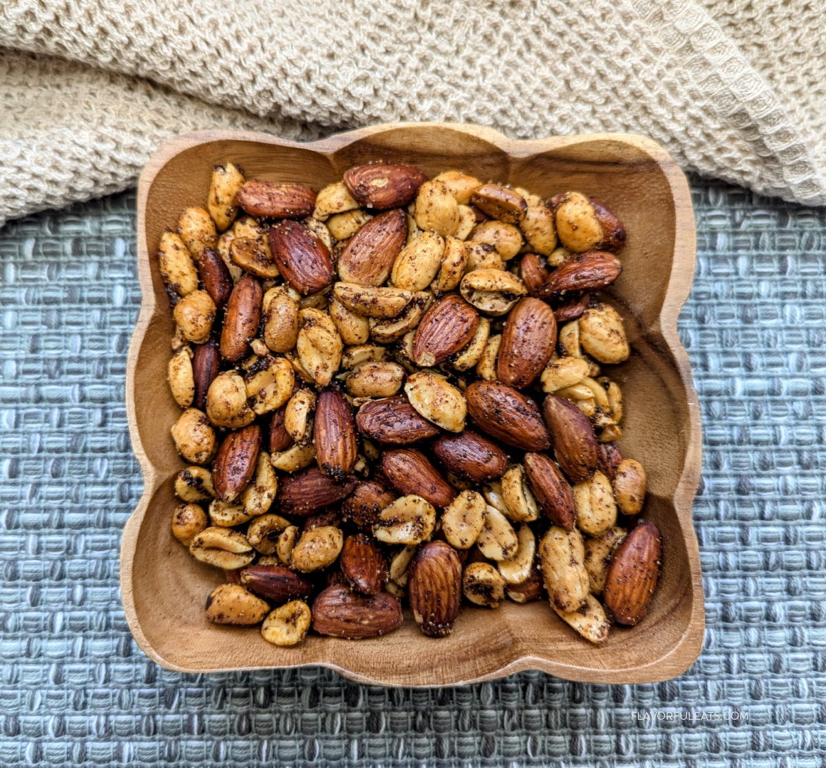 Ghost Pepper Roasted Nuts in a square wooden bowl.