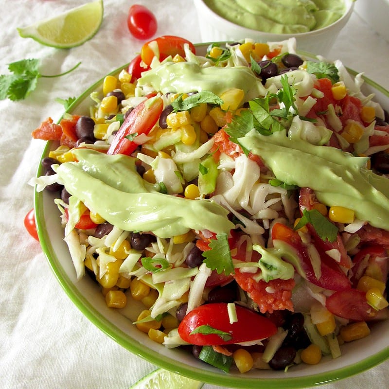 smoked salmon corn cabbage bowl with avocado lime crema