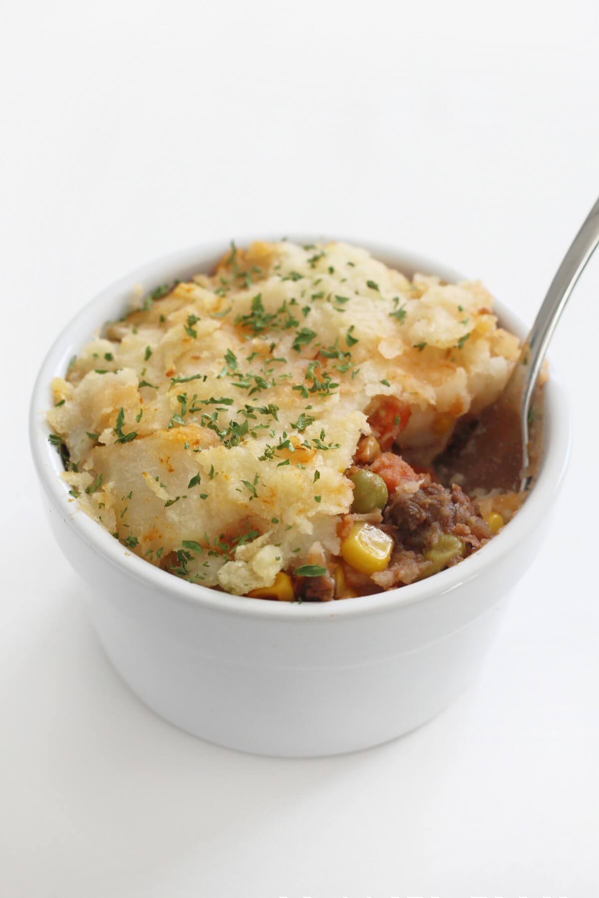 single white ramekin with vegan lentil shepherd