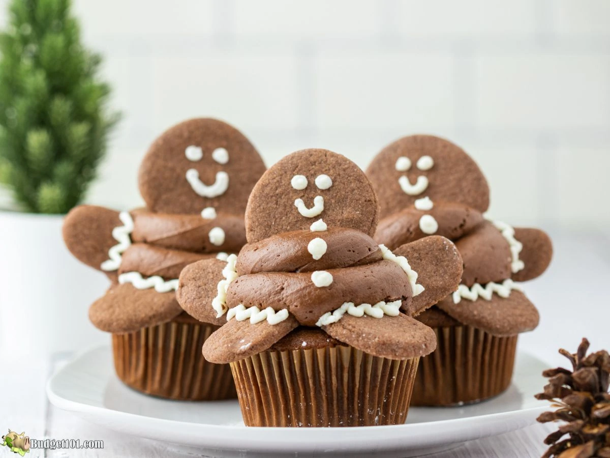 Gingerbread man cupcakes topped with swirls of gingerbread buttercream.